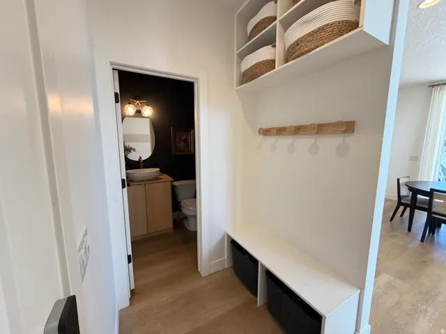 Built-in entryway bench with integrated shelving and coat rack