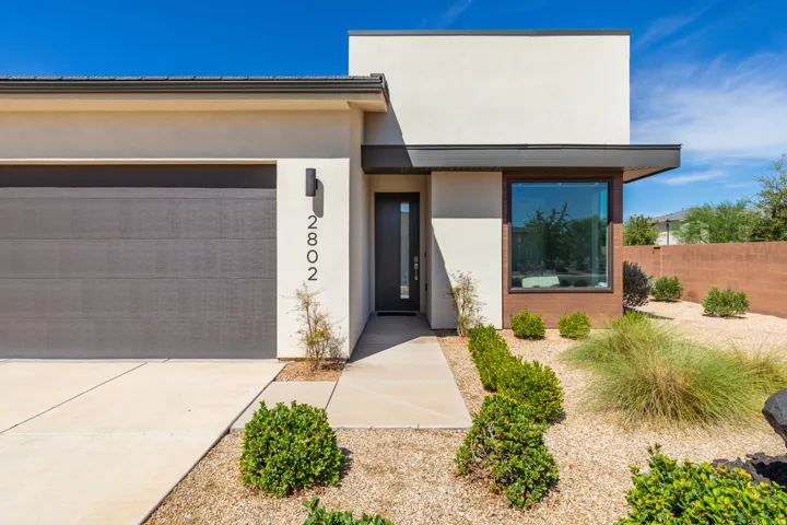 Contemporary exterior with a smooth stucco finish and a flat roofline