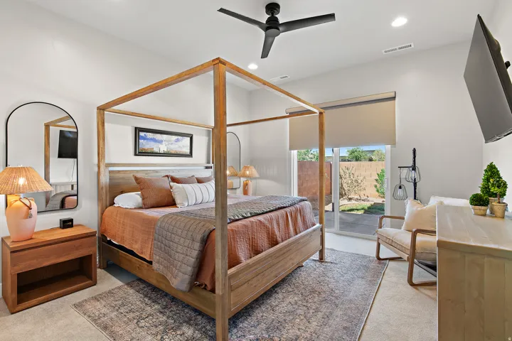 Recessed lighting, ceiling fan, and sliding glass door to outdoor space
