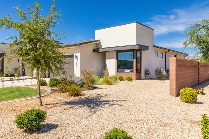 Contemporary exterior with stucco finish and dark trim accents