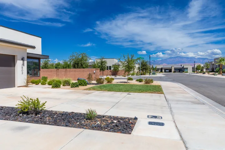 Modern architectural style featuring a flat roofline and stucco exterior