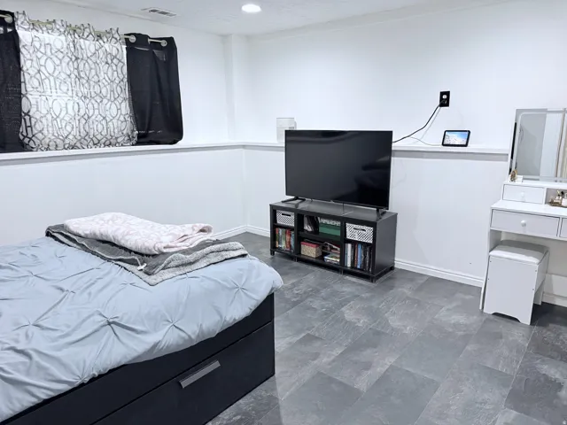 Recessed lighting, tile flooring, and white painted walls