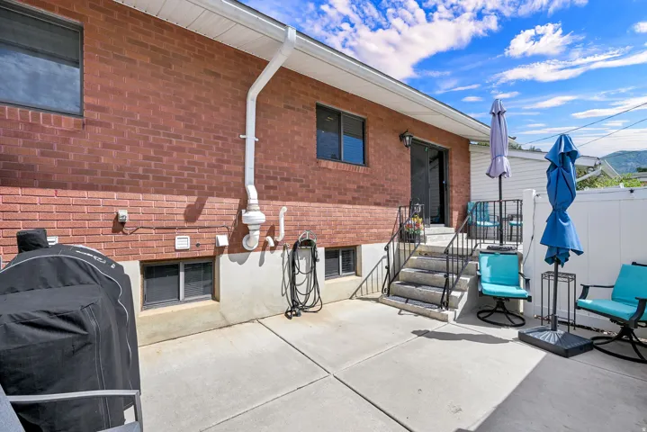 Brick exterior with concrete patio