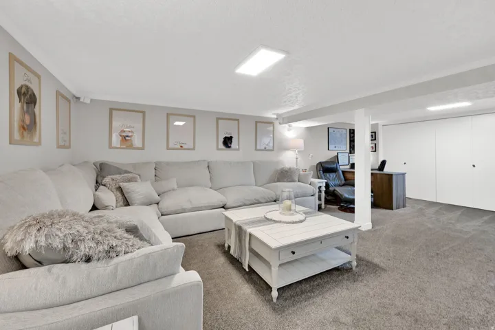 Spacious recreation room featuring recessed lighting, a built-in closet with sliding doors, and ample floor space