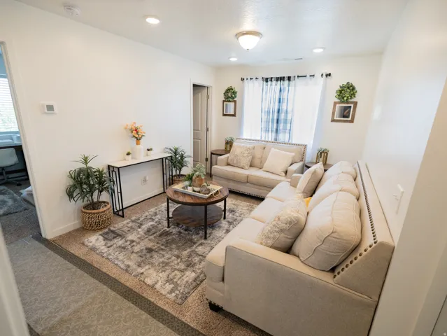 Recessed ceiling lighting, durable carpeting, wall-to-wall window treatments, and a built-in thermostat