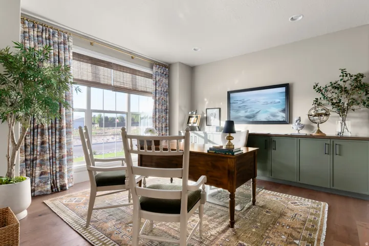 Hardwood flooring, expansive window, recessed lighting, built-in cabinetry, wood-finish countertop