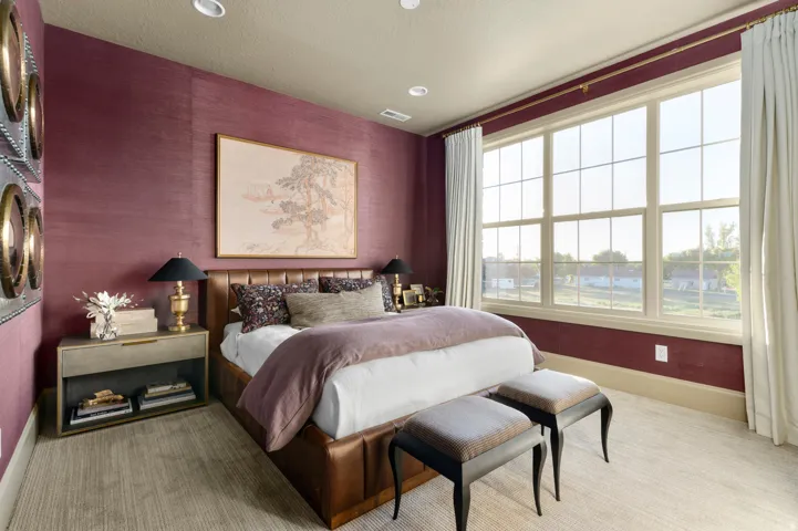Expansive window with grid panes, textured wall covering, recessed lighting, and carpeted flooring