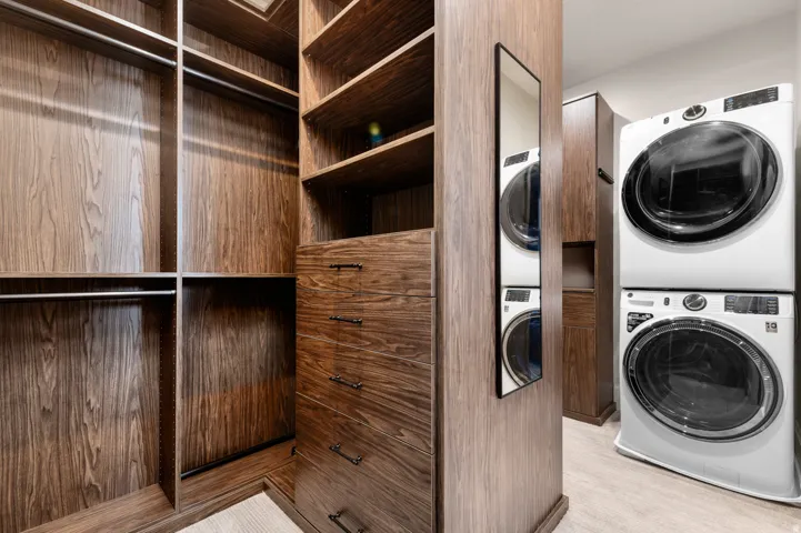 Built-in custom cabinetry with wood-finish, integrated shelving, and drawers