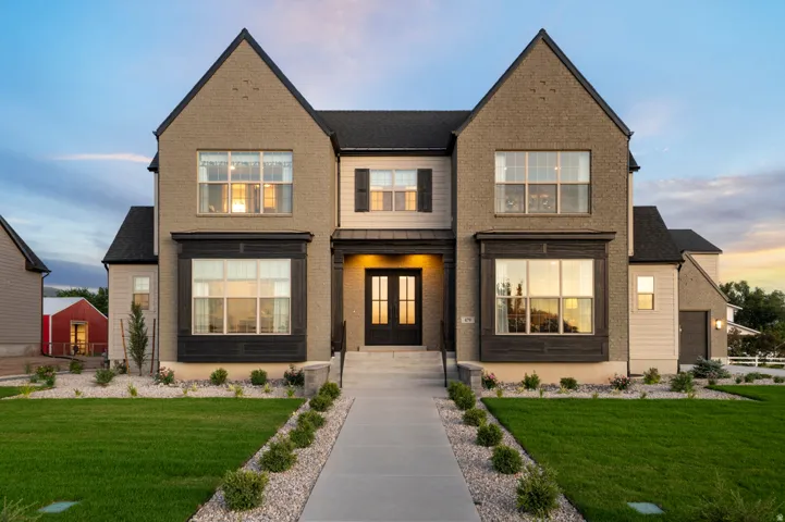 Brick and siding exterior with a gabled roofline