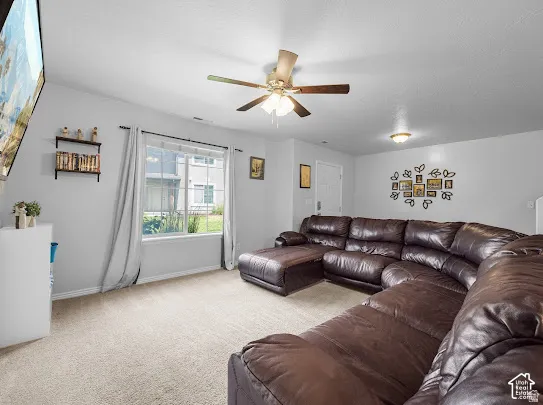 Recessed lighting, ceiling fan, and carpeted flooring