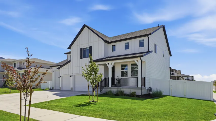 Modern farmhouse exterior with white board-and-batten siding