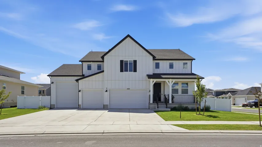 White vertical siding exterior with black trim accents
