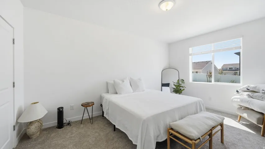 White painted walls, white trim, recessed lighting, and a window with horizontal blinds