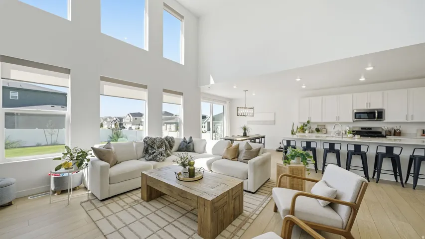 Vaulted ceilings and abundant natural light highlight the open-concept living area
