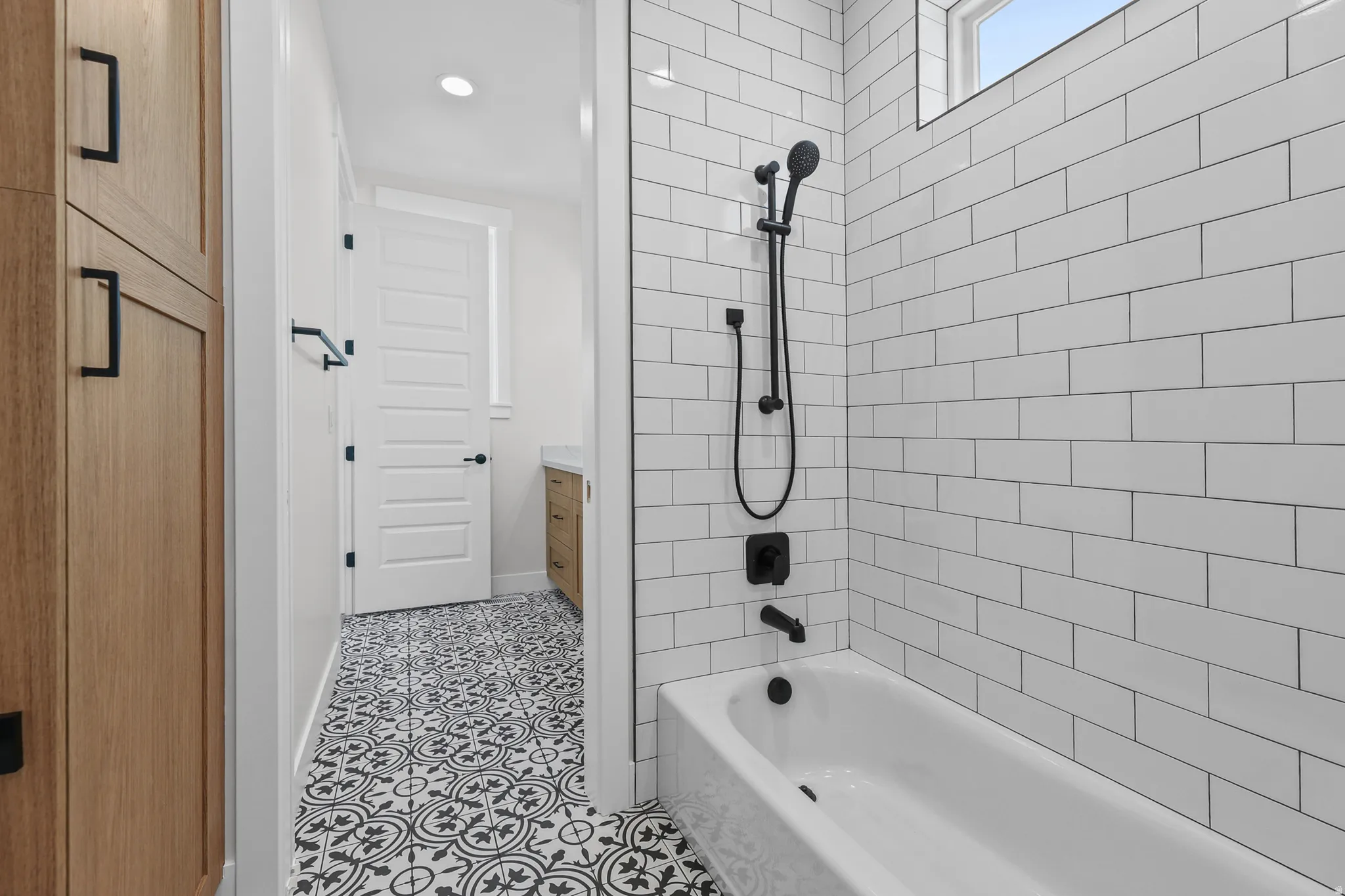 White subway tile shower surround with matte black fixtures