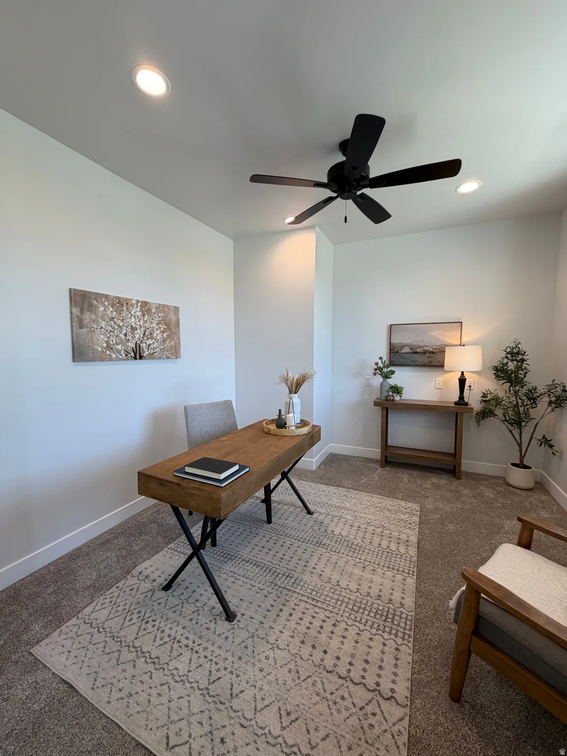 Recessed lighting, ceiling fan, and carpeted flooring