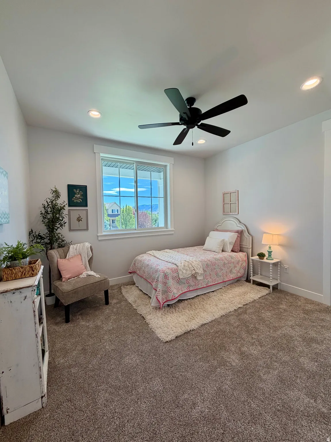 Wall-to-wall carpeting, recessed ceiling lighting, a ceiling fan, and a window with white trim