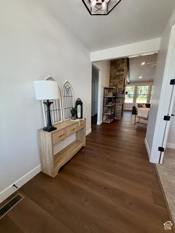 Warm wood-finish flooring extending into the main living area
