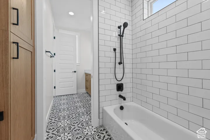 White subway tile shower surround with matte black fixtures