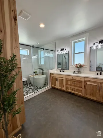 Dual sink vanity with wood-finish cabinetry and white countertops