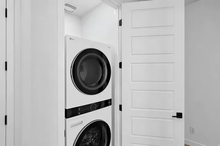 Integrated laundry center with stacked appliances