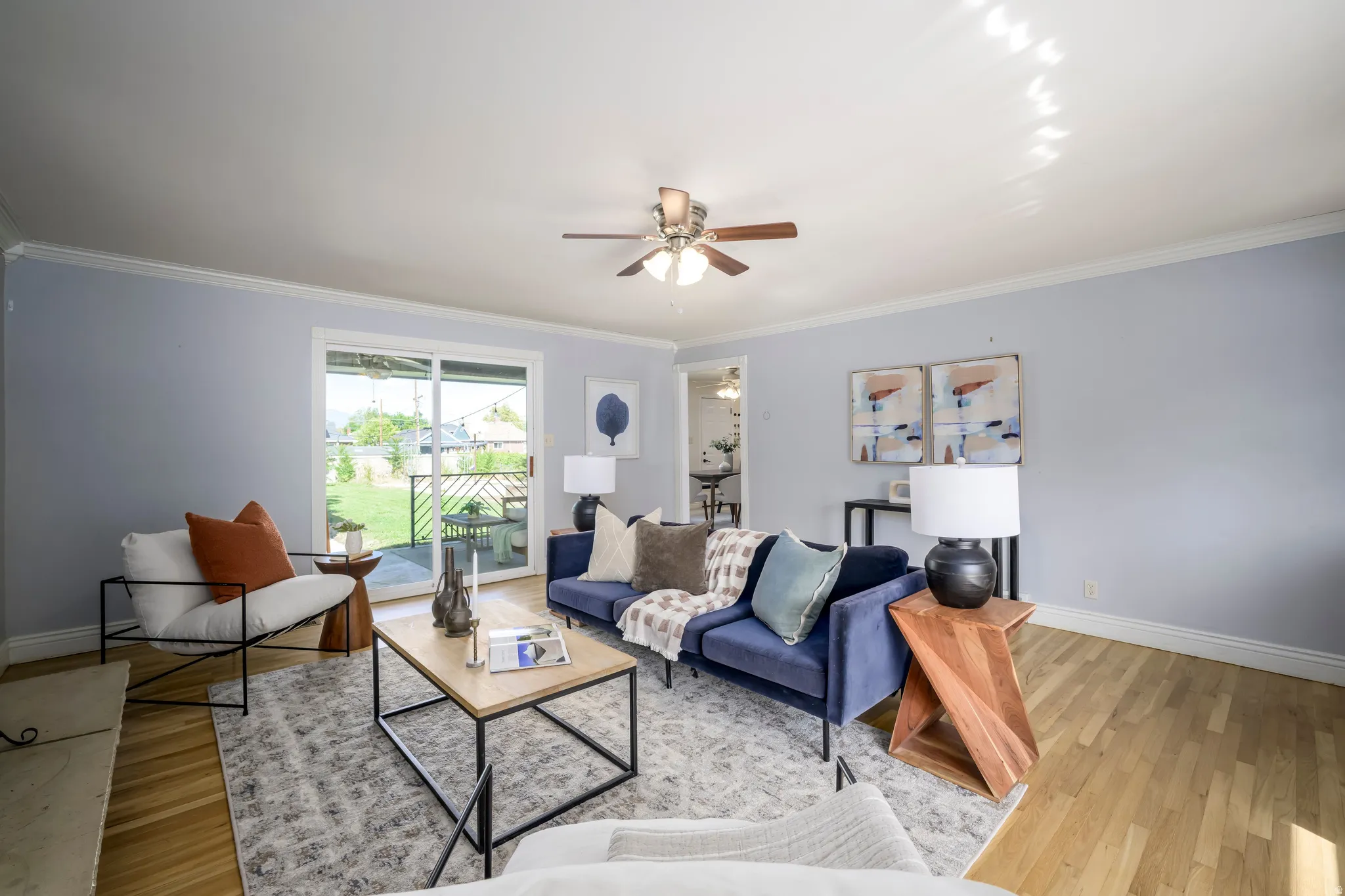 Recessed lighting, wood-finish flooring, ceiling fan, and sliding glass door