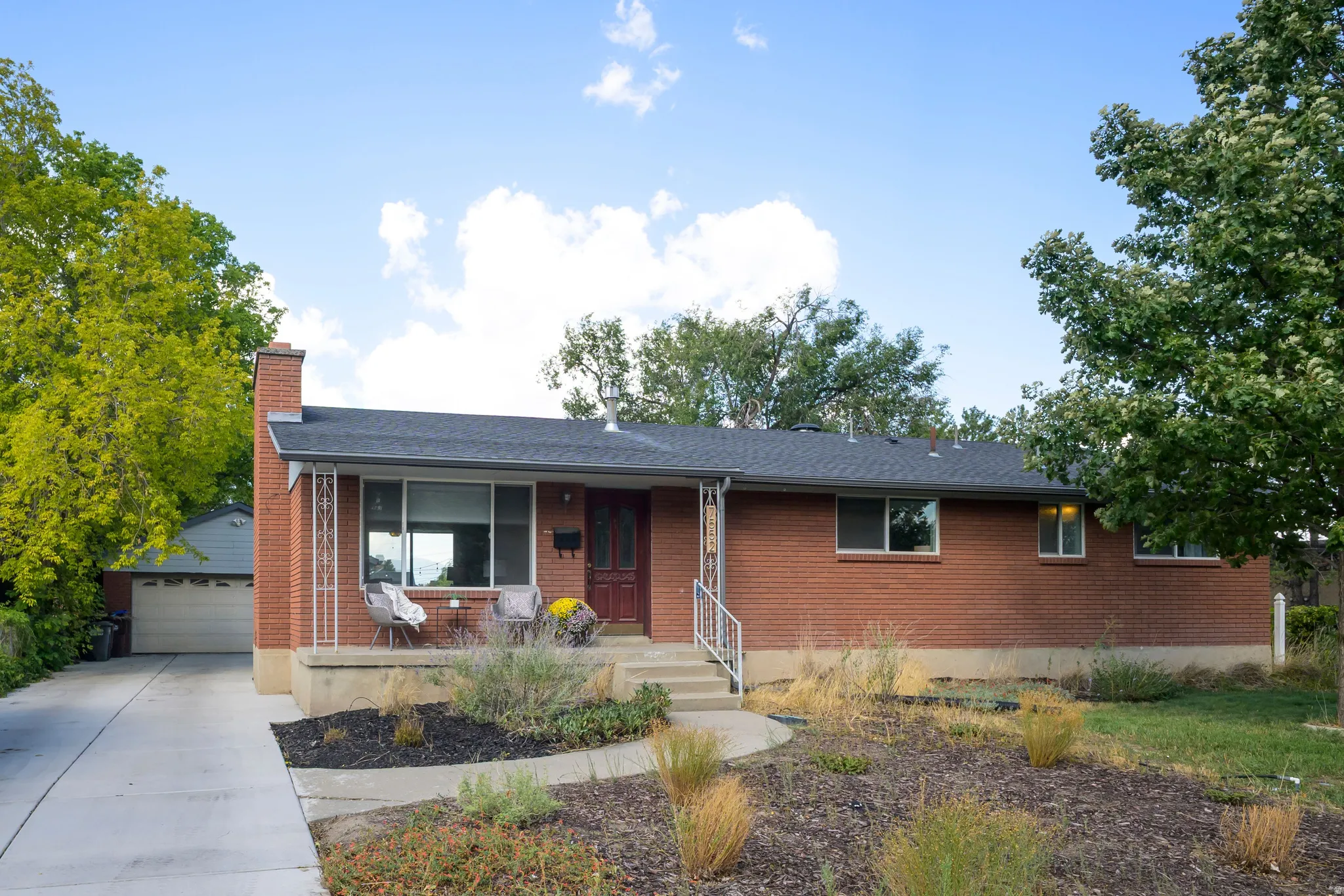 Brick exterior with a dark-shingle roof