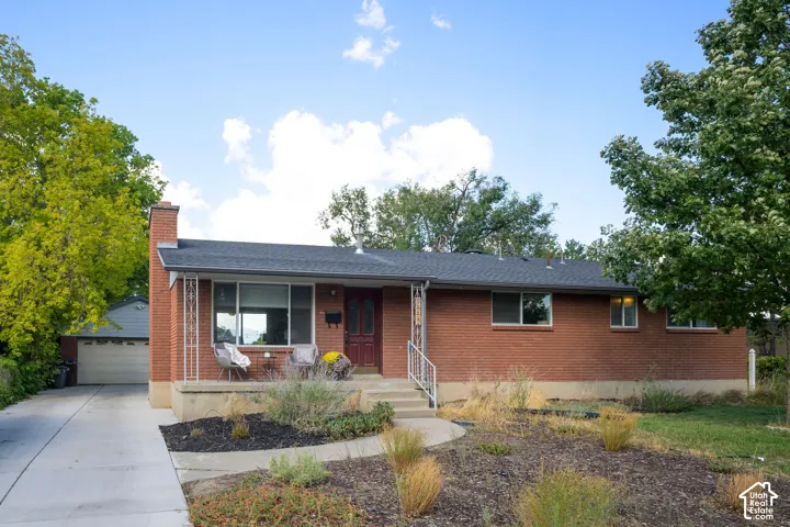 Brick exterior with a dark-shingle roof