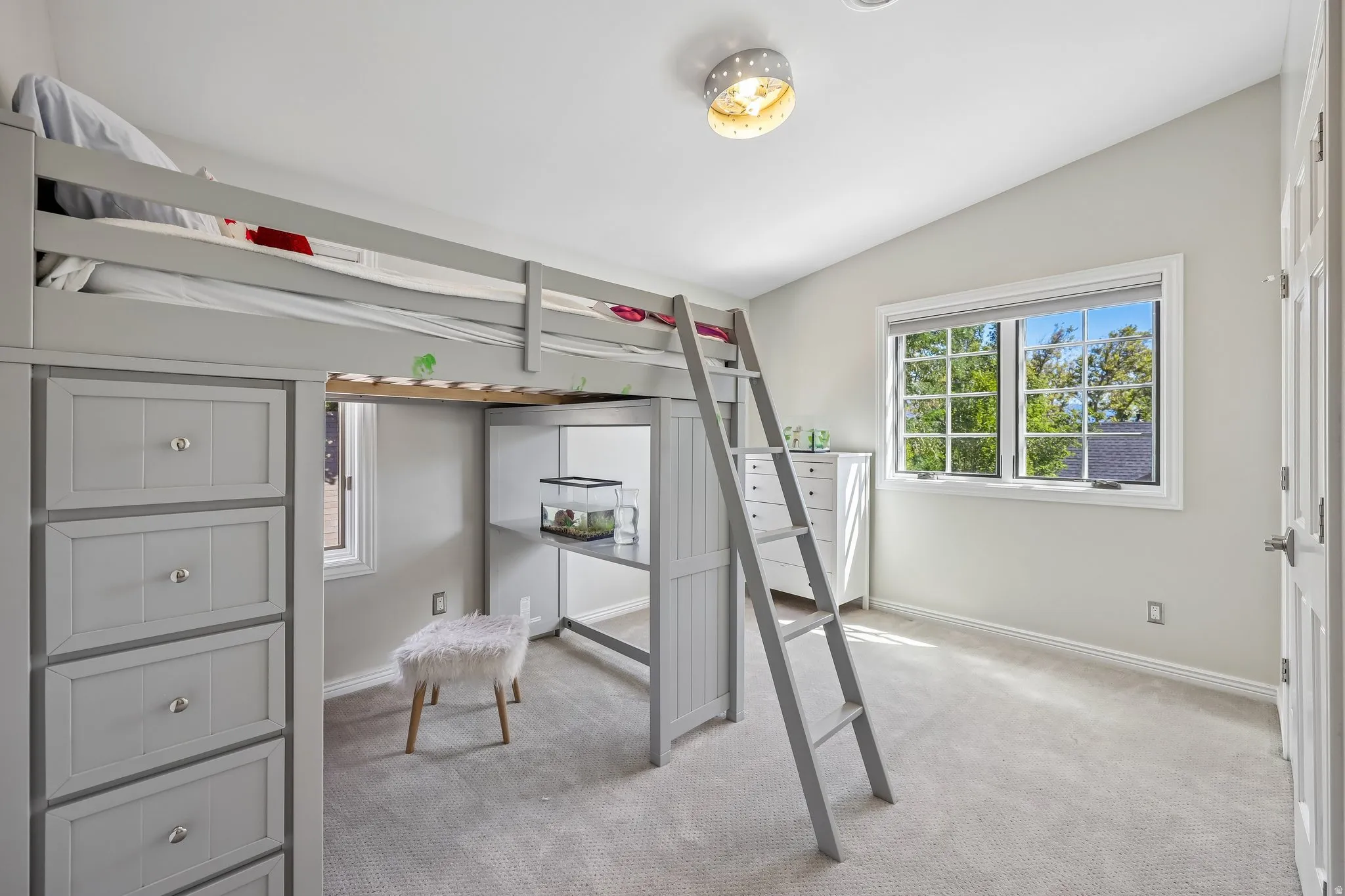 Vaulted ceiling, recessed lighting, double-pane window, flush mount light fixture, carpeted flooring
