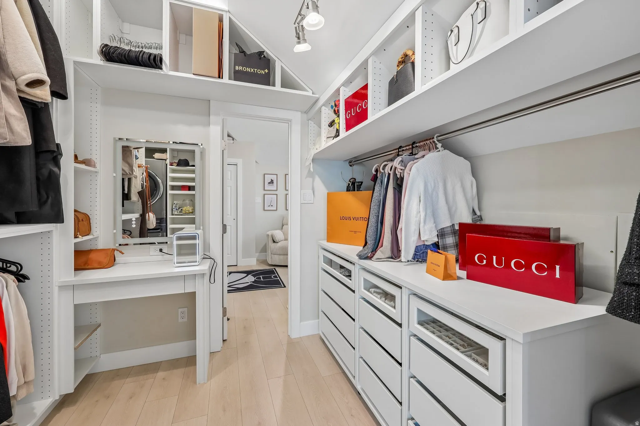 Custom built-in closet system with extensive shelving, hanging rods, and integrated drawers