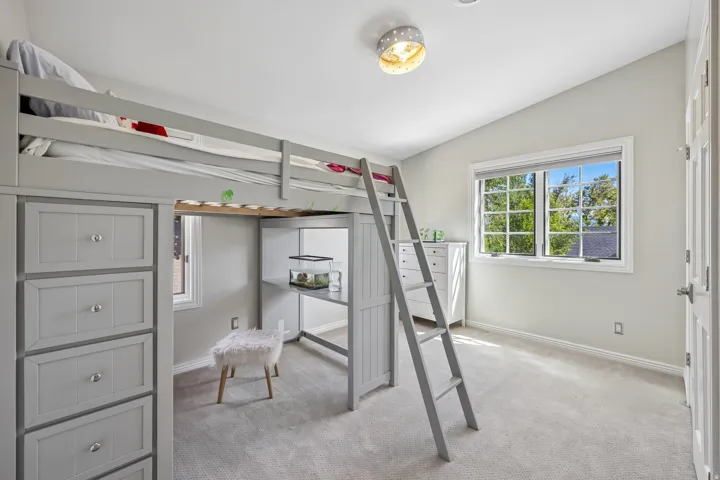 Vaulted ceiling, recessed lighting, double-pane window, flush mount light fixture, carpeted flooring
