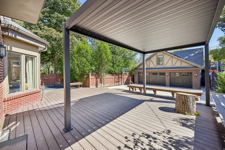 Expansive composite deck featuring a modern pergola