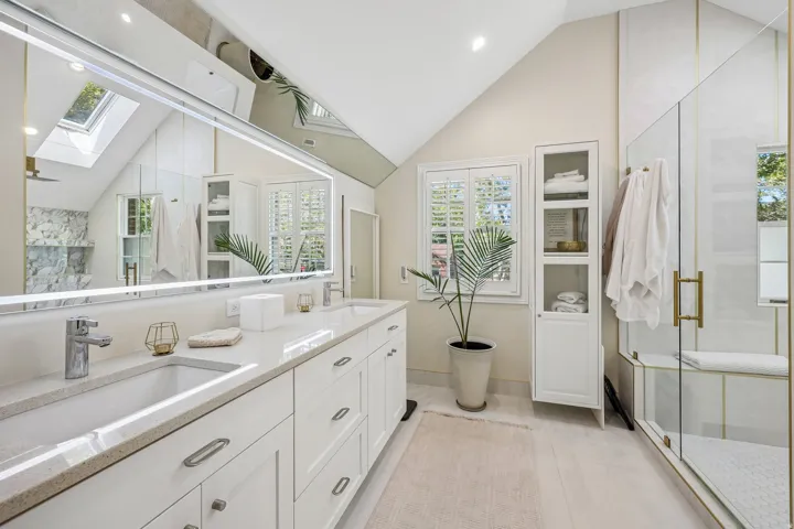 Dual vanity with under-mount sinks and stone countertops