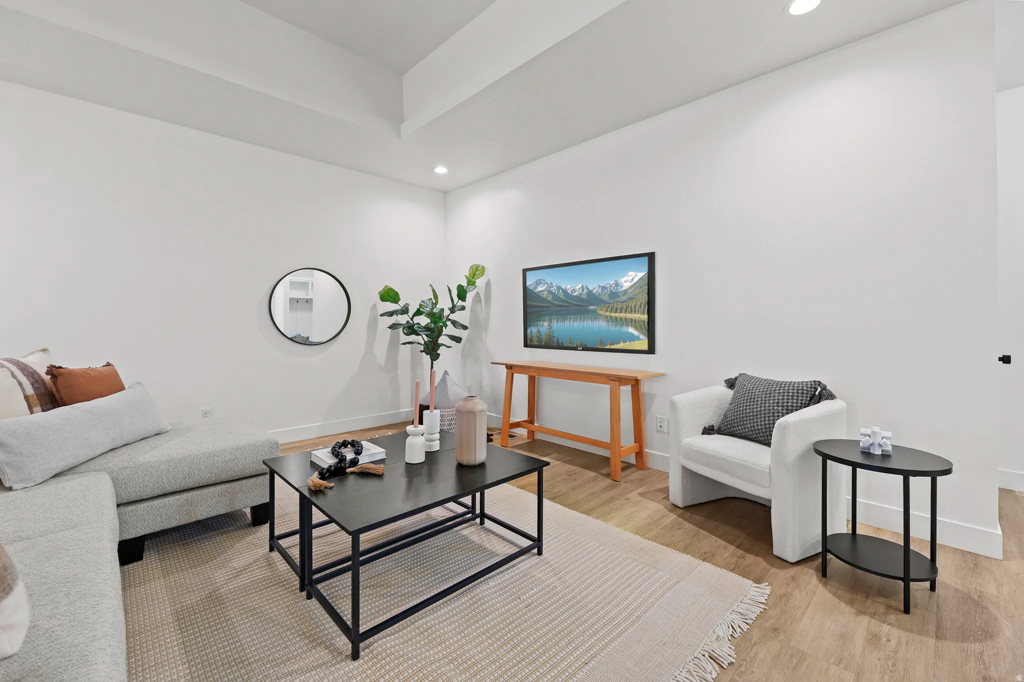 Recessed lighting, wood-finish flooring, white walls, and white trim