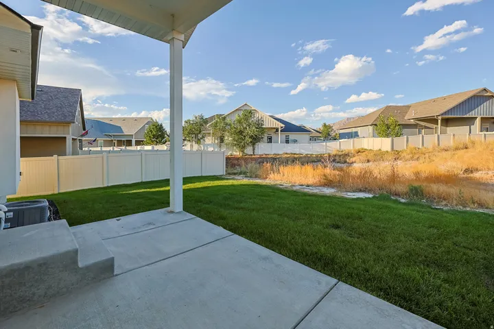 Covered patio with concrete flooring and steps