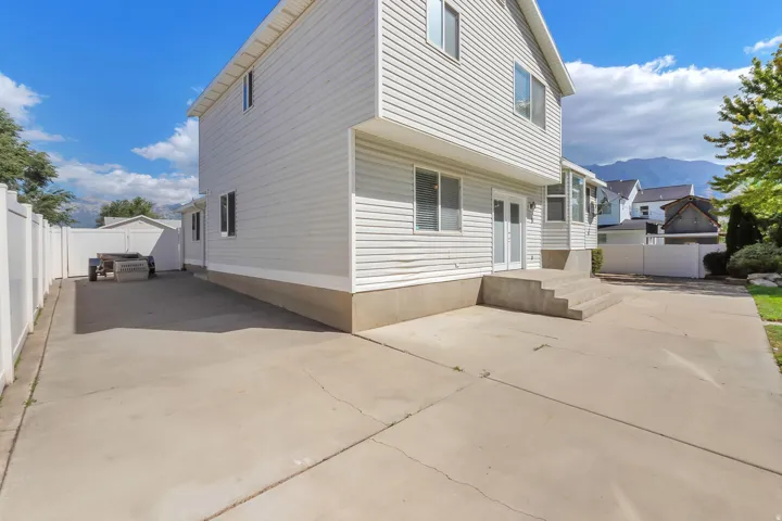 White vinyl siding exterior with multiple windows