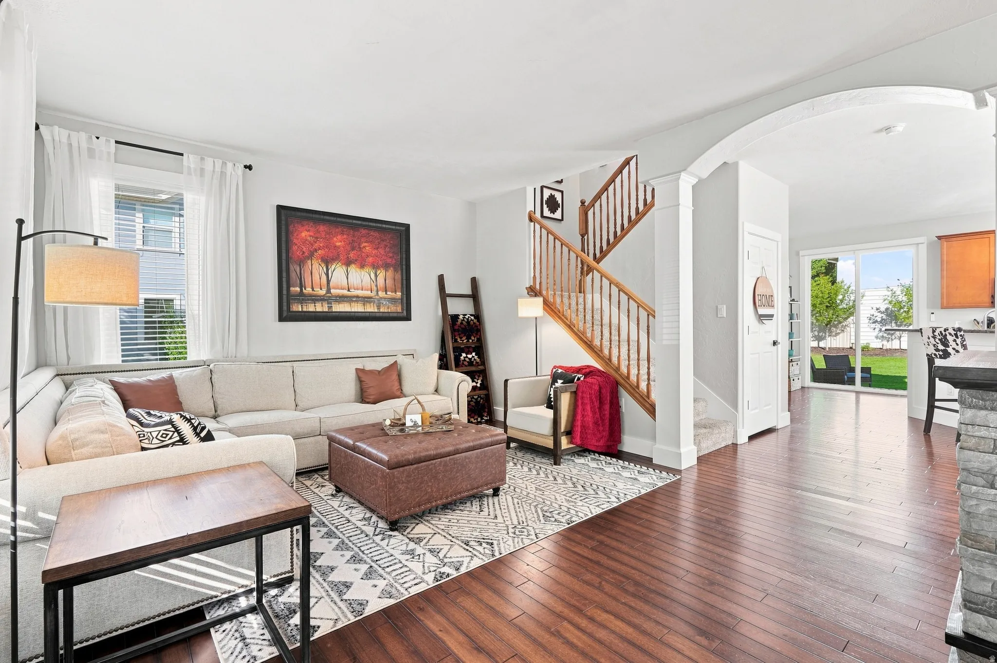 Warm wood-finish flooring complements the open living area