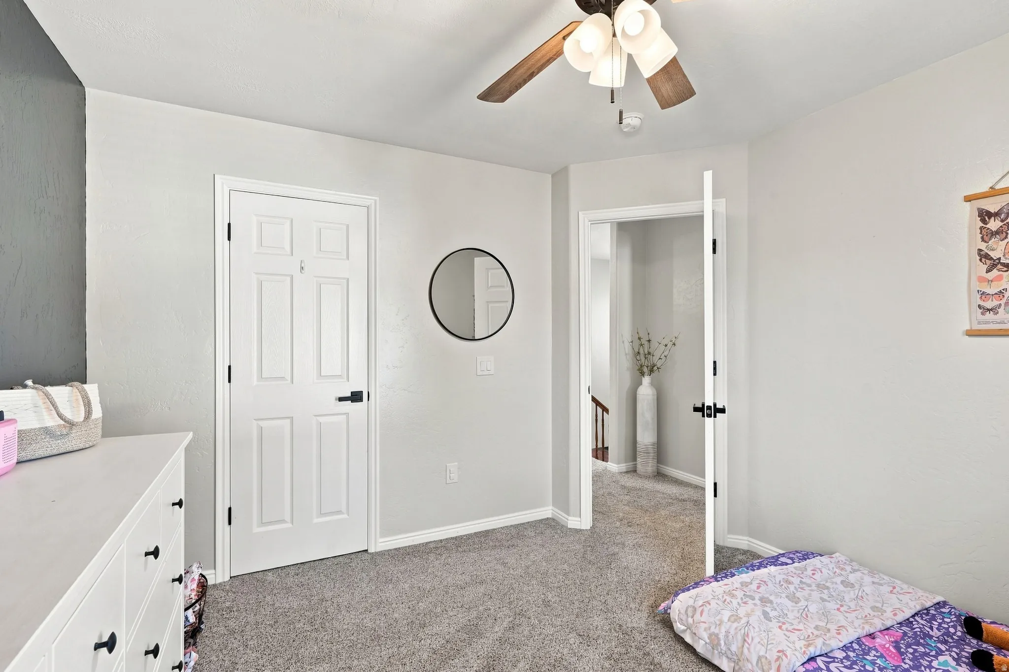 Neutral-toned walls complement plush carpeting