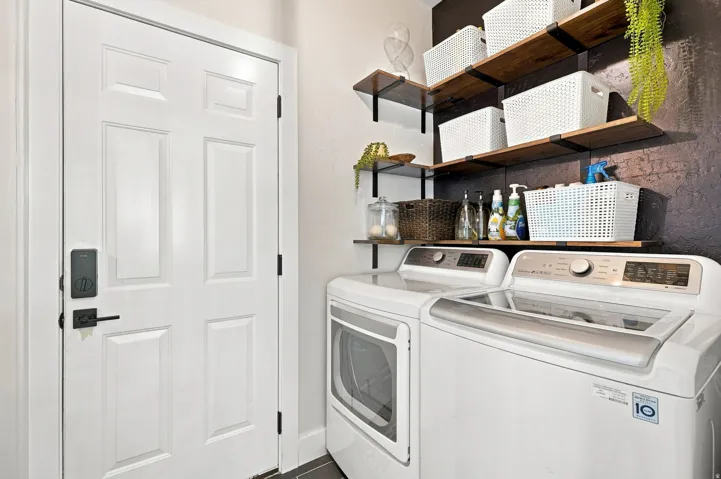 Built-in shelving with wood-finish planks and black metal brackets