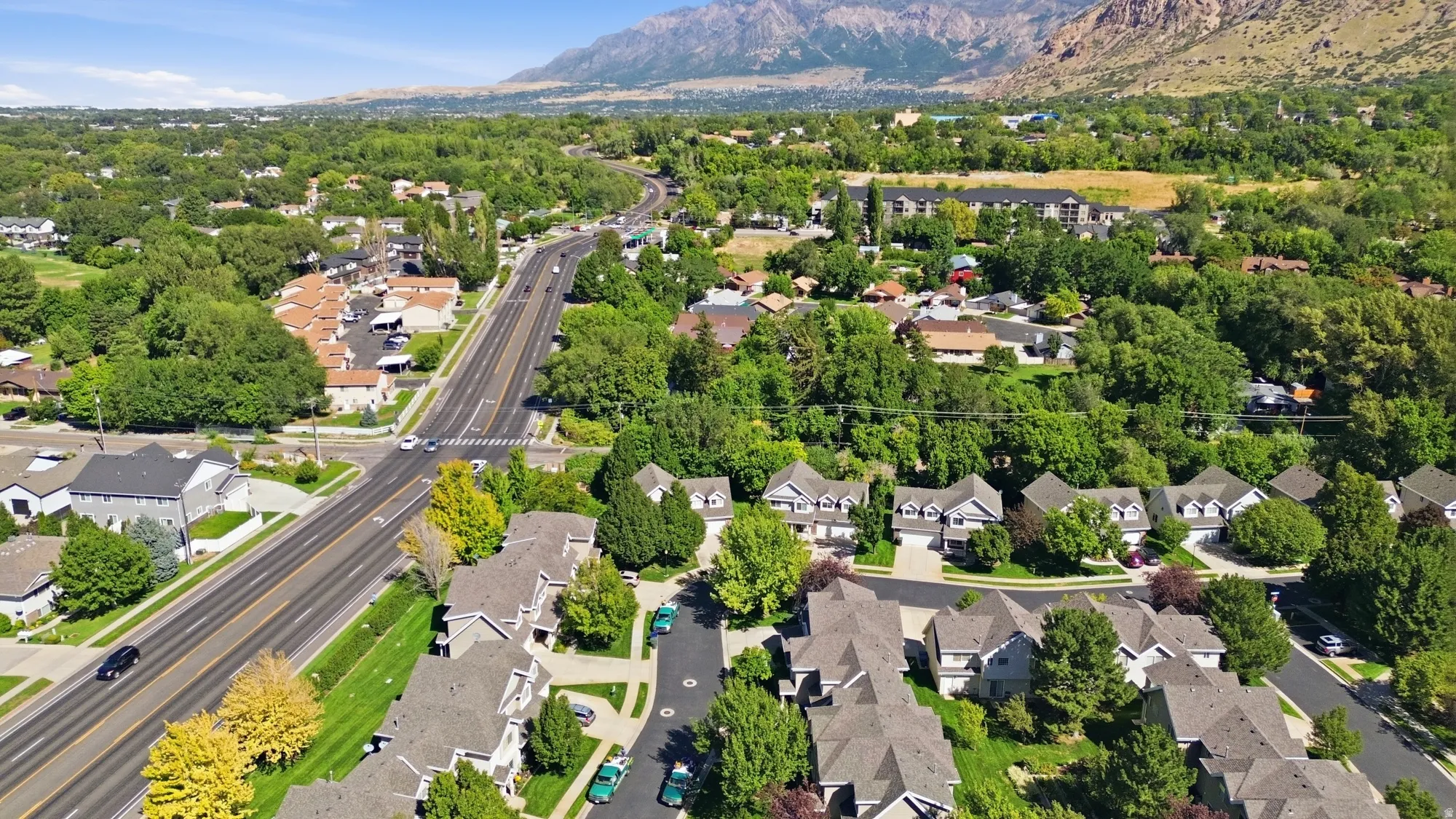 Additional contWide aerial view highlighting the neighborhood’s incredible proximity to the mountains and scenic Ogden Canyon