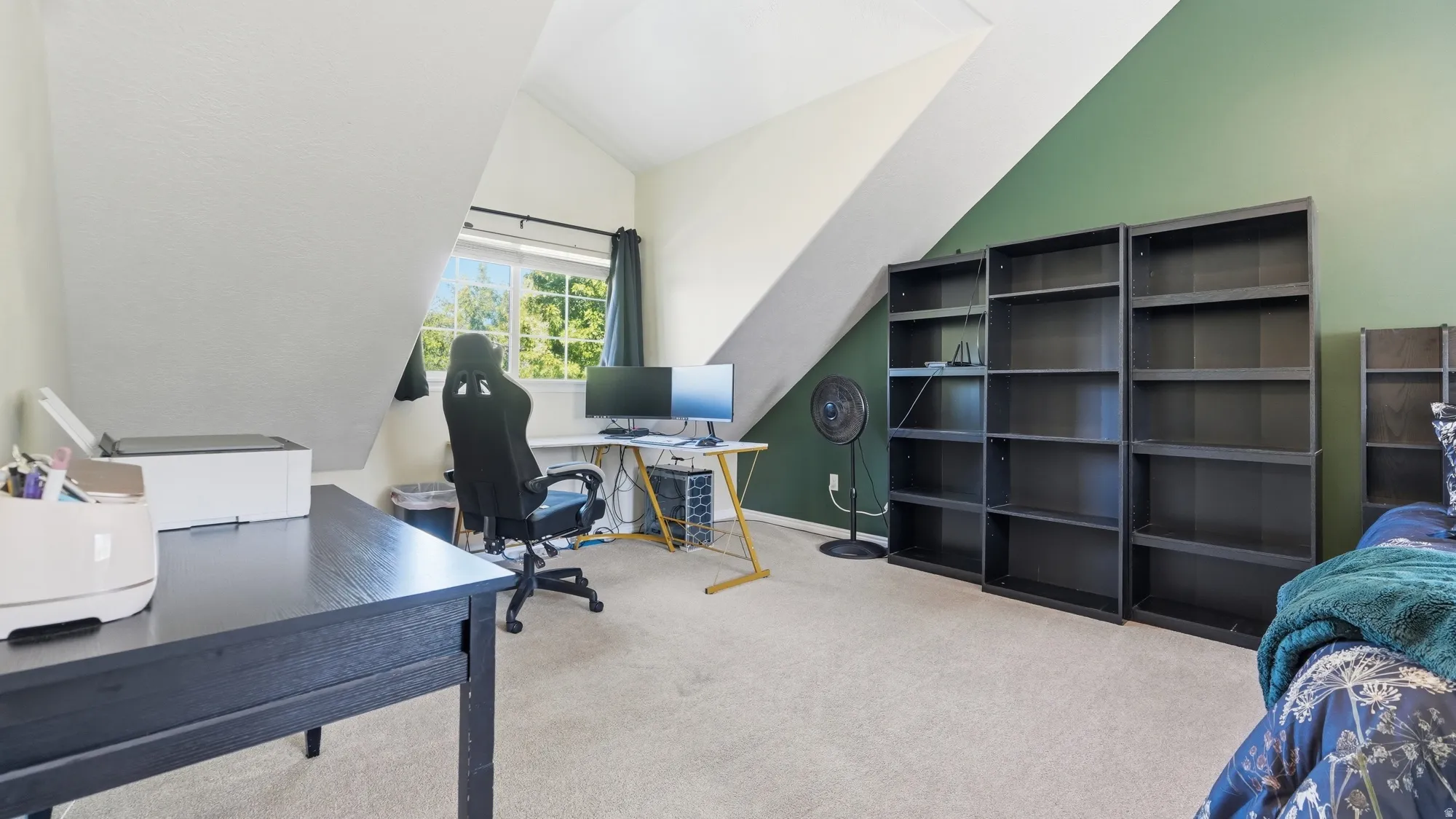 Generously sized primary bedroom offers a flexible layout with space for a dedicated desk or work-from-home area.