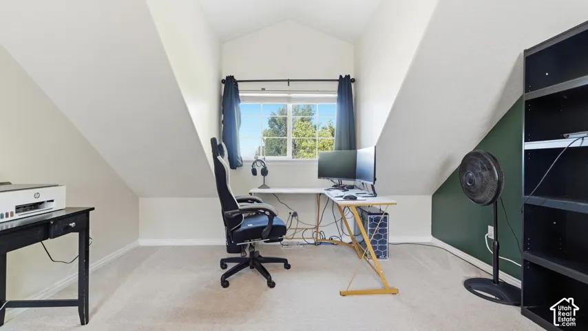 Bright built-in-feeling workspace area with a large window and plenty of natural light, tucked neatly into the spacious primary suite.
