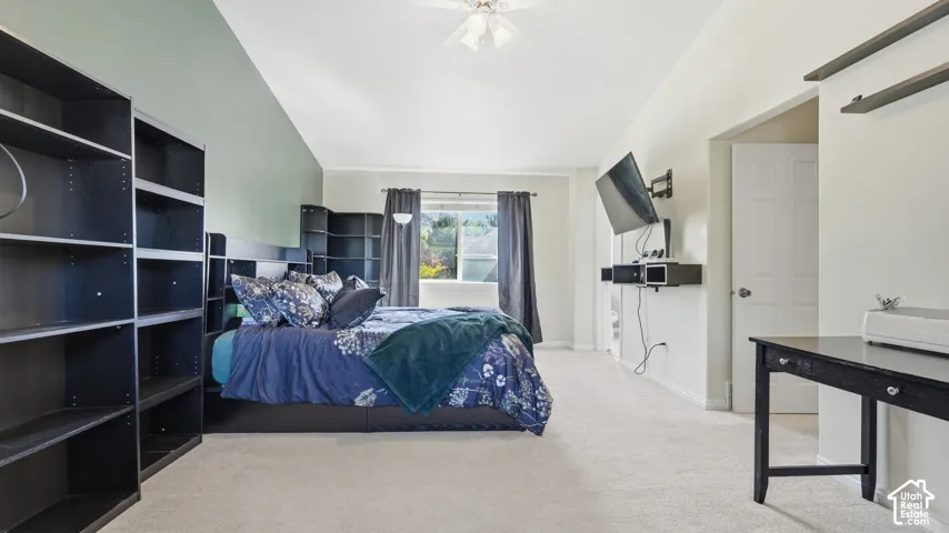Large primary suite features vaulted ceilings, great natural light, and plenty of room to create a comfortable private retreat.