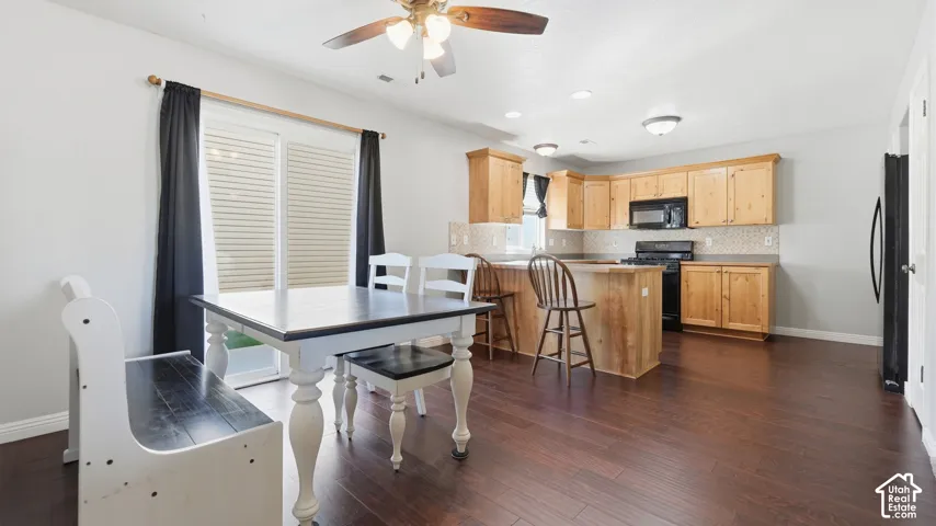 Spacious kitchen features abundant cabinet and counter space, breakfast bar seating, and an open layout perfect for everyday living and entertaining.