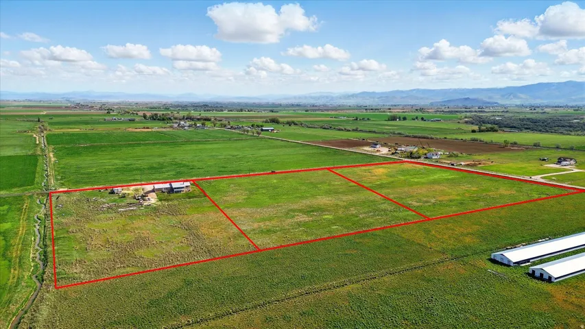 Expansive land parcels outlined in red, featuring a mix of cultivated and undeveloped terrain