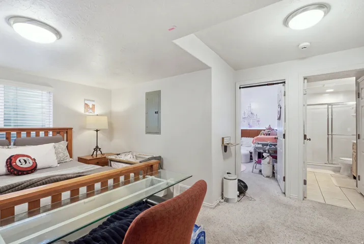 Carpeted flooring, recessed lighting, and white walls