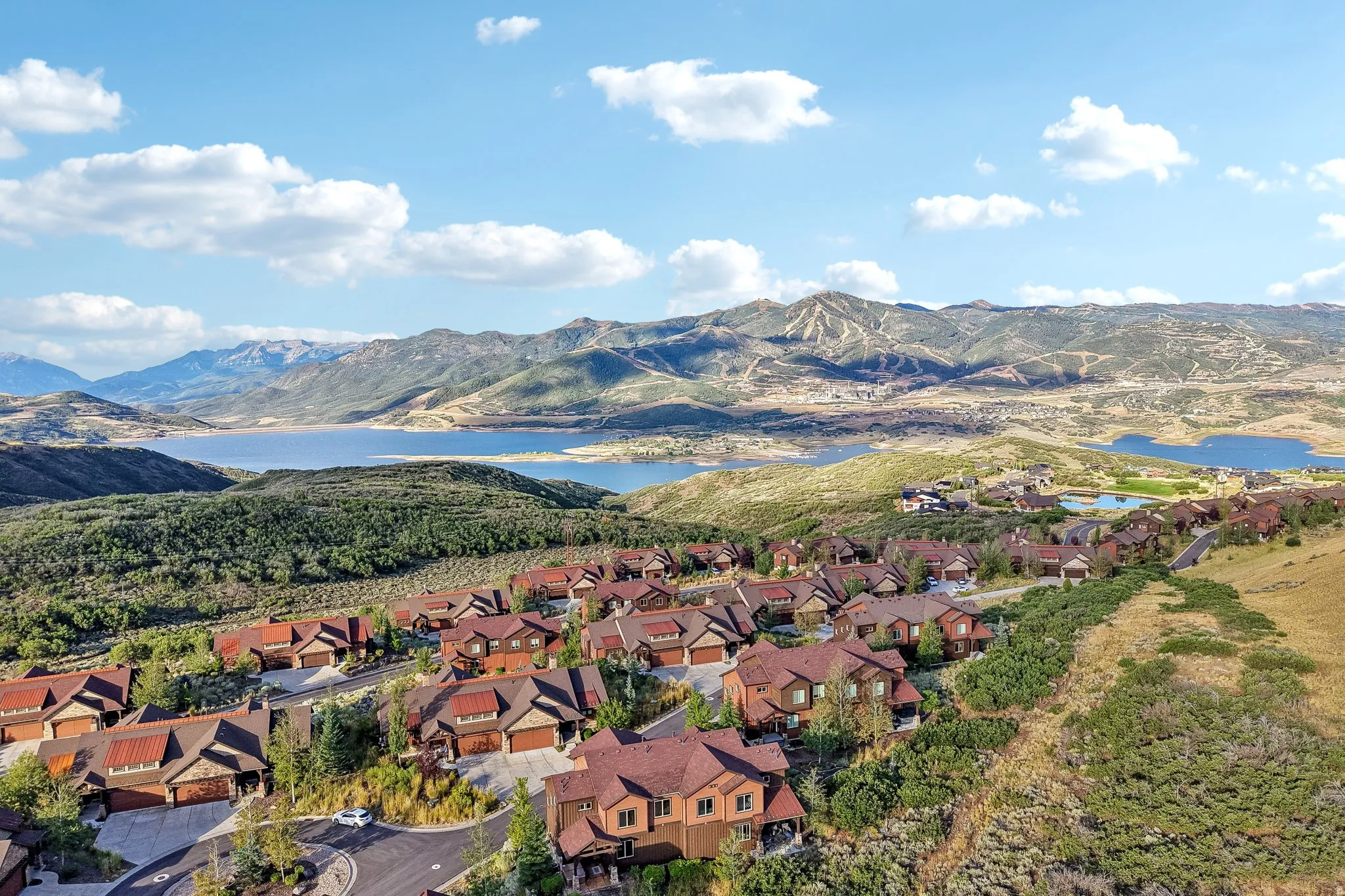 Aerial view of Jordanelle Reservoir above the rooftops of the Rustler at Hideout community in Hideout, Utah.