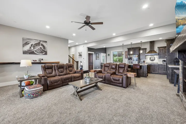 Open-concept main level with the living room, dining area and kitchen in one run, in a Rustler at Hideout home near Jordanelle Reservoir.