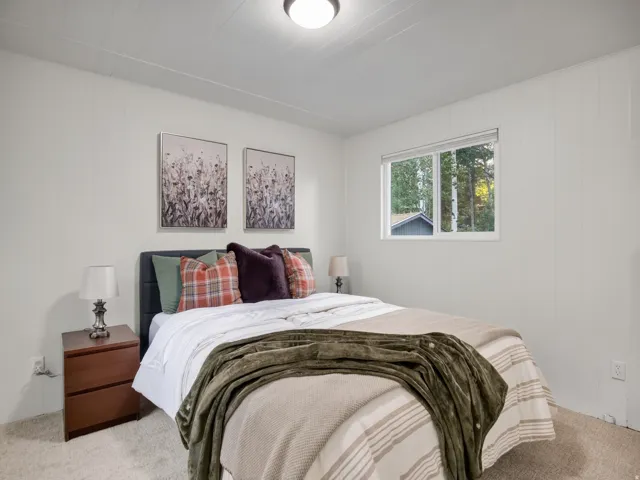 Window with outdoor scenery, light-colored walls, recessed ceiling lighting