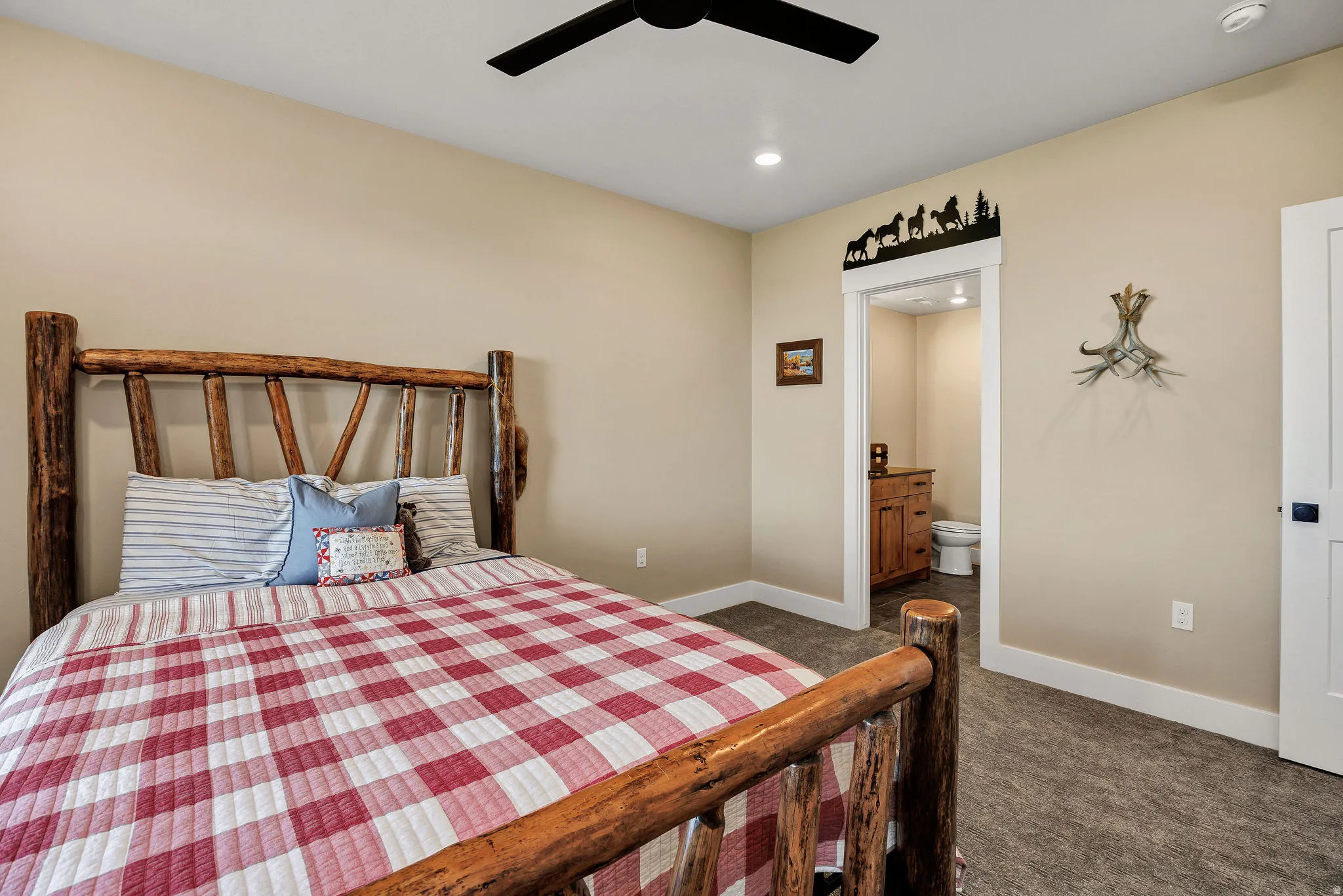 Neutral wall paint, recessed lighting, ceiling fan, carpet flooring, and a white interior door